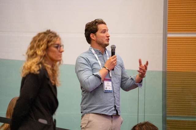 A delegate asking a question from the floor