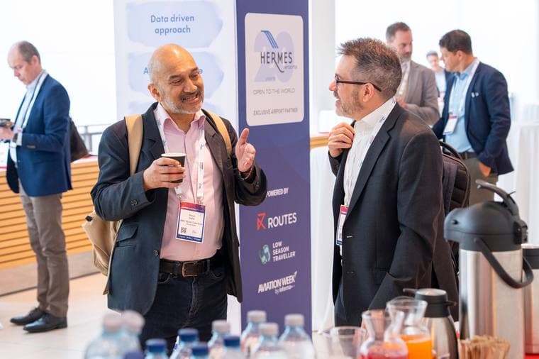 Delegates talking over coffee during a break