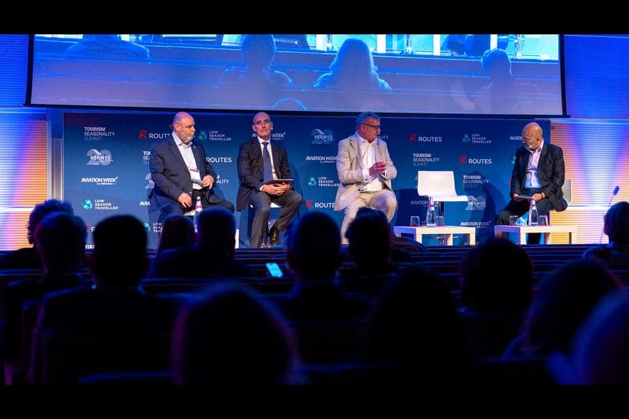 A full auditorium watching a panel session at the third Tourism Seasonality Summit in Rimini